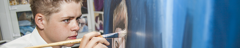 Student painting on a canvas