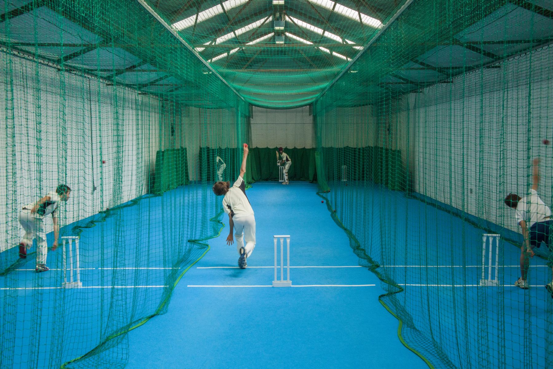 Student bowling in the cricket nets